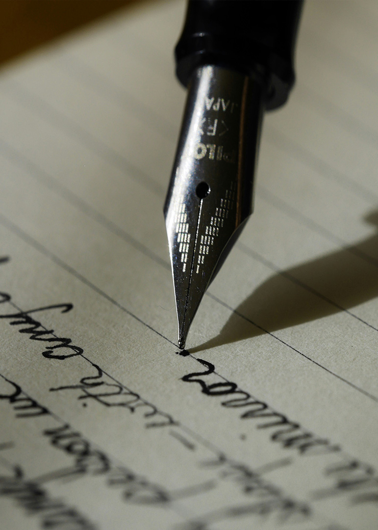 Fountain Pen writing on Paper. photo credit: aaron-burden-y02jEX_B0O0-unsplash 